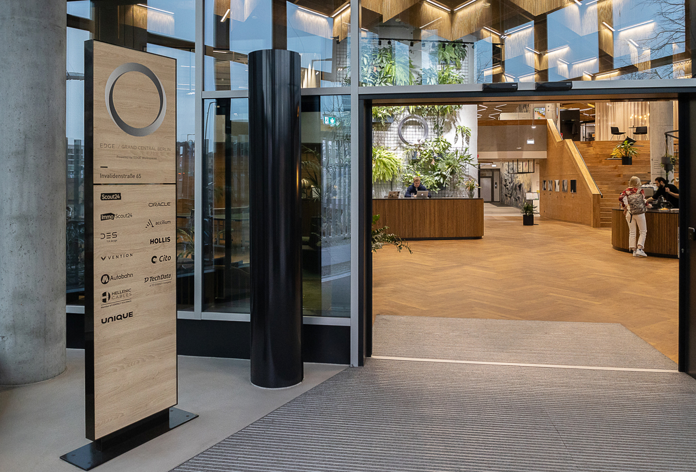 Tenant directory sign panel repeated across a multi-location building entrance program