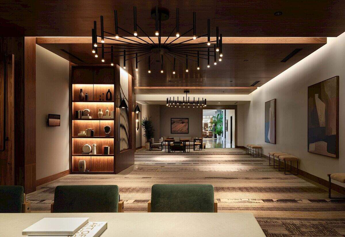Built-in millwork display shelving integrated into a hospitality lobby