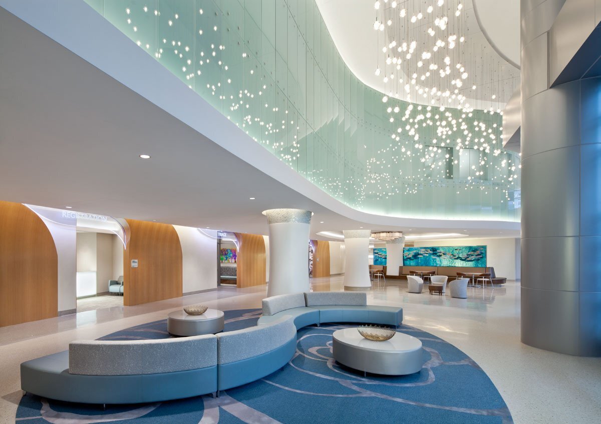 Hospital atrium with clear wayfinding signage for registration and triage