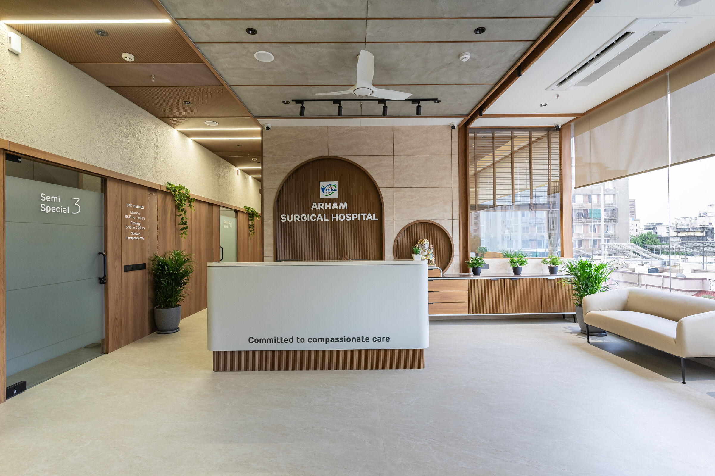 Welcoming hospital reception desk with integrated identity signage