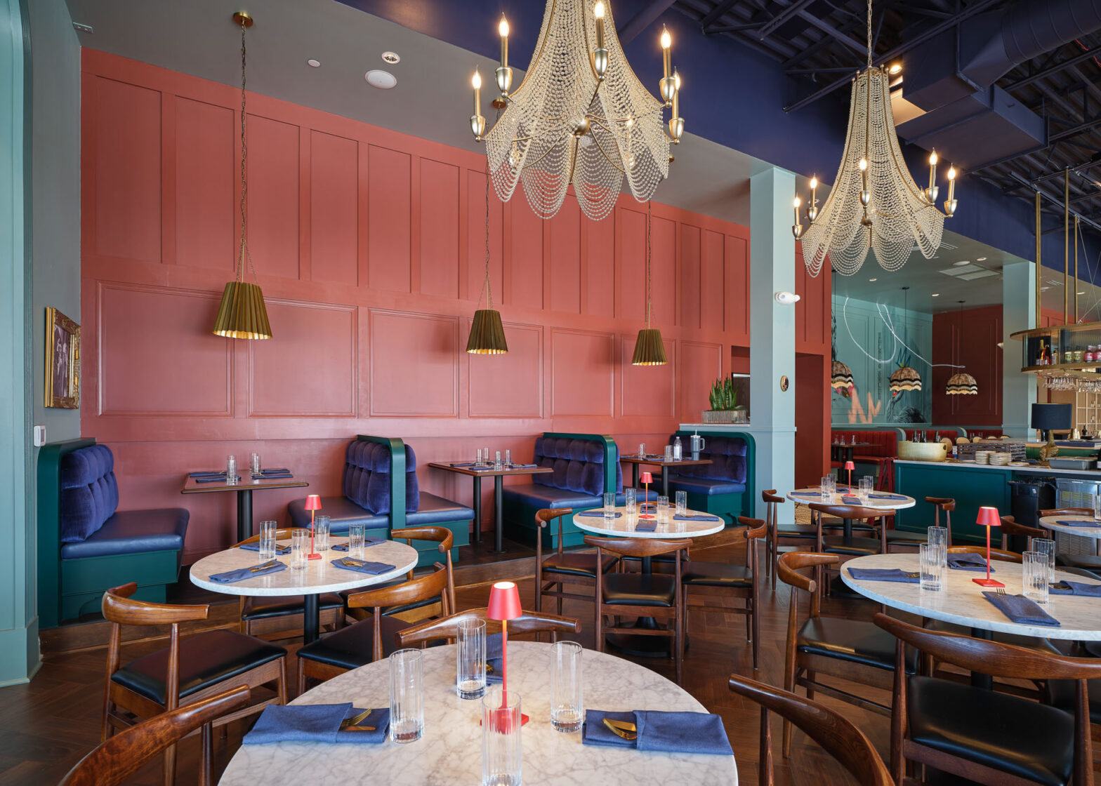 Hospitality dining room with coordinated furniture, lighting, and finishes