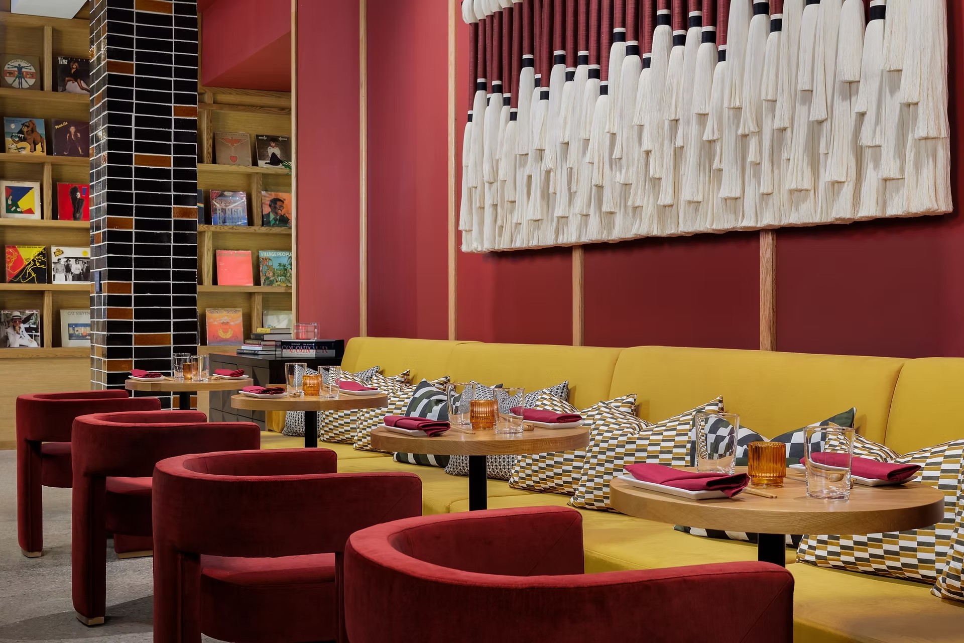 Custom hospitality lounge with a bespoke fiber art installation