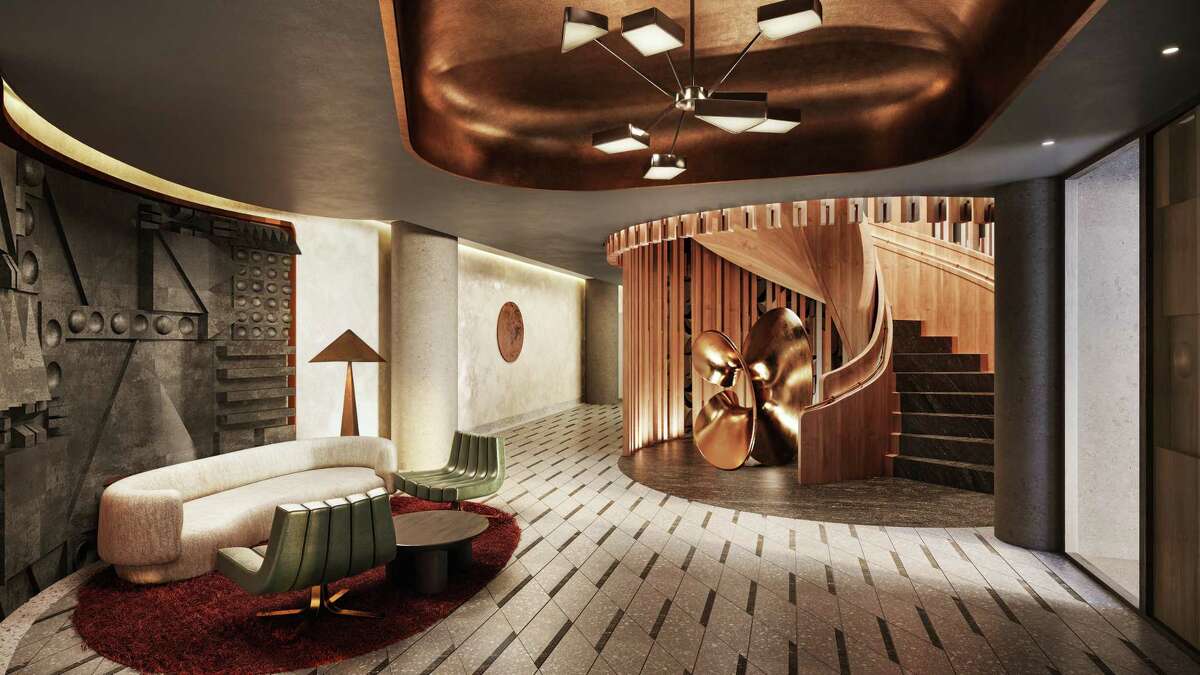 Custom star-form pendant chandelier and bronze sculptural artwork on the club floor at Conrad Los Angeles